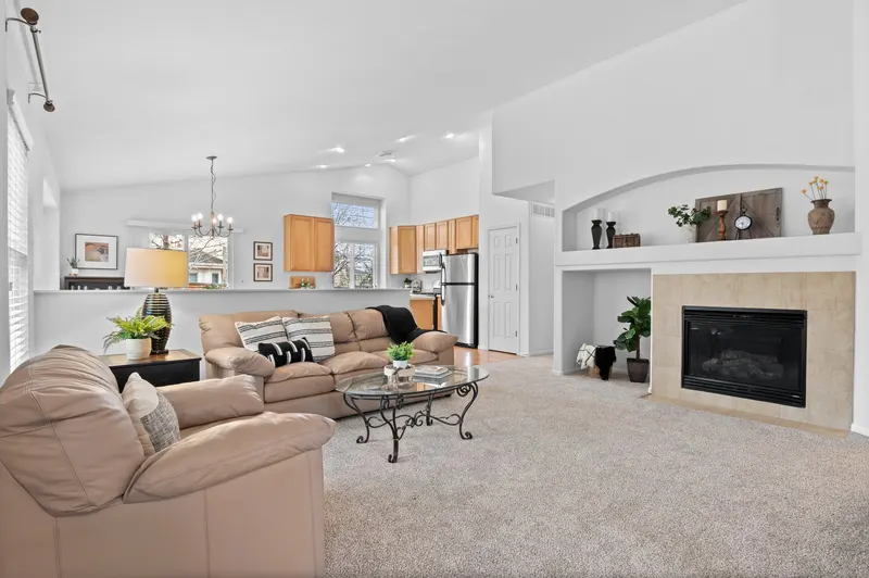 Same living room after new carpet, fresh paint, and staging